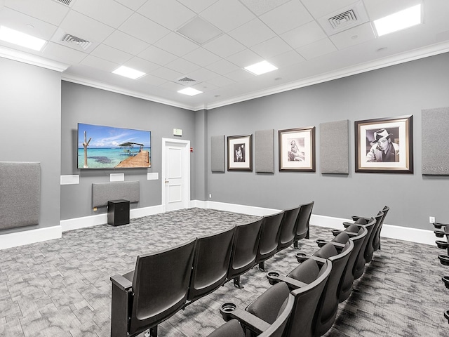 cinema with a drop ceiling and crown molding