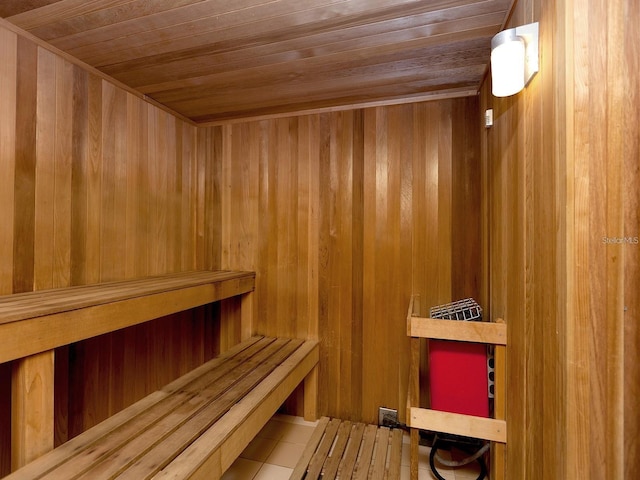 750 N Tamiami Trl Unit 420, Sarasota, FL 34236 - relaxing sauna with wood ceiling, tile patterned flooring, and wooden walls