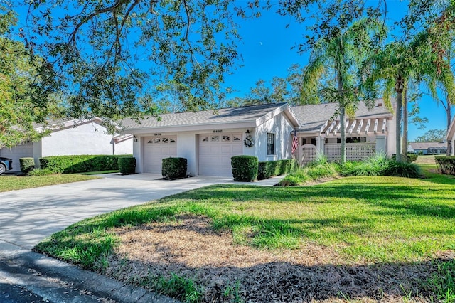 ranch-style home featuring a front yard and a garage