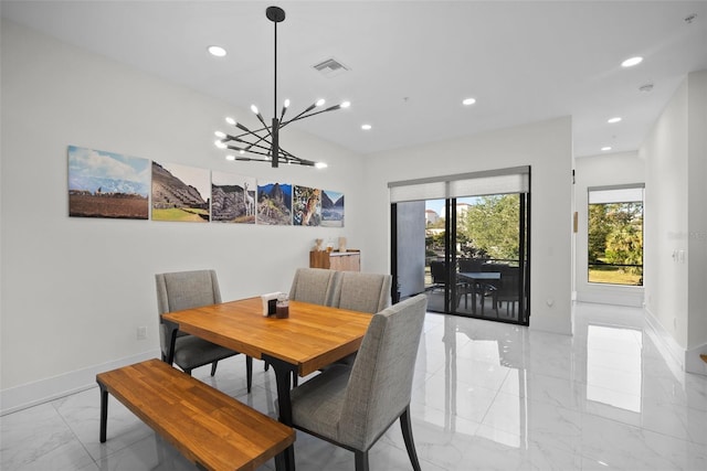 dining space featuring an inviting chandelier