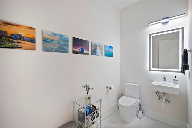 bathroom with sink and toilet