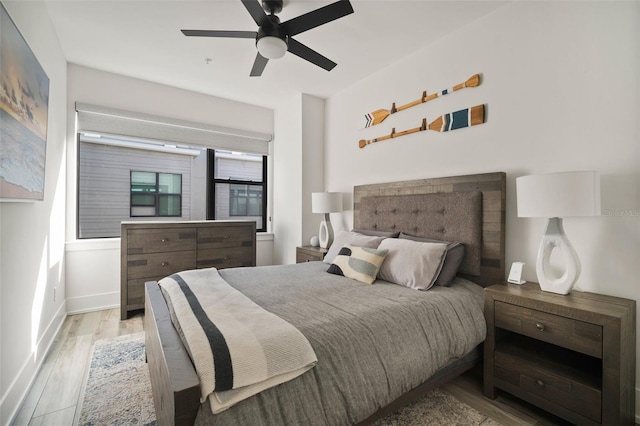 bedroom featuring ceiling fan and light hardwood / wood-style flooring