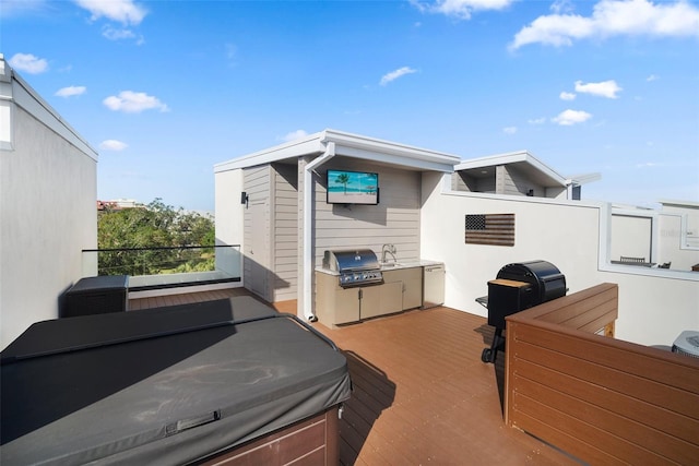 view of side of property with a hot tub and sink