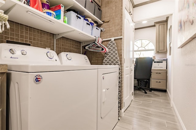 laundry room featuring washing machine and clothes dryer