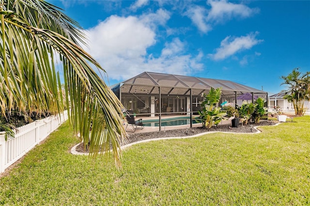 view of yard featuring a lanai and a fenced in pool