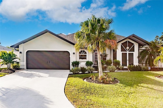 view of front facade featuring a front lawn and a garage