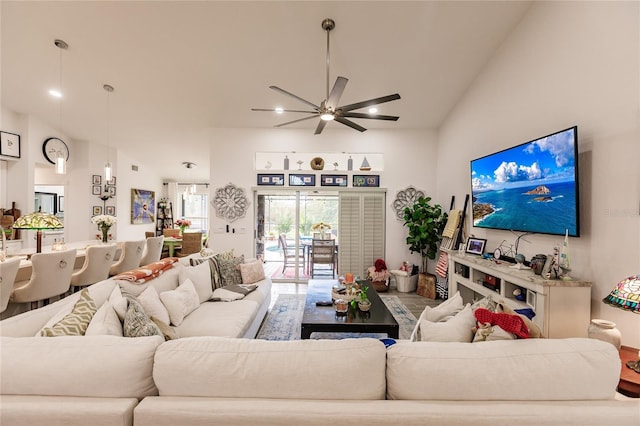 living room with high vaulted ceiling and ceiling fan