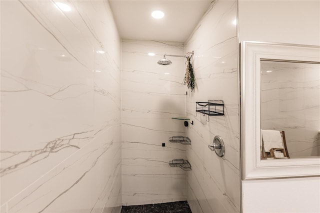 bathroom with a tile shower