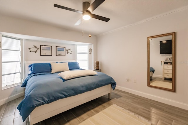 bedroom featuring ceiling fan and light hardwood / wood-style flooring