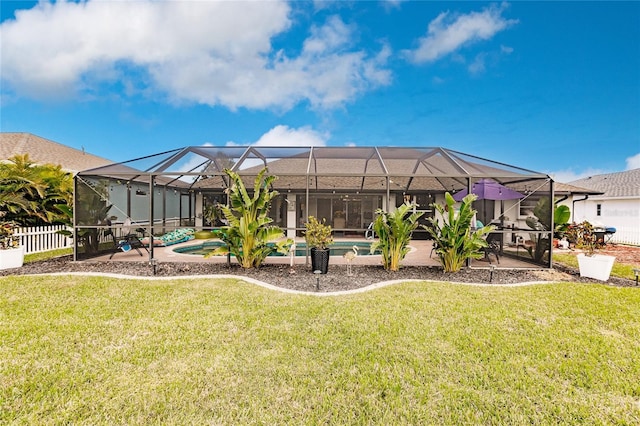 view of yard featuring glass enclosure and a patio area