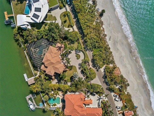 drone / aerial view with a beach view and a water view