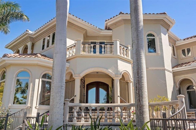 back of house with a balcony