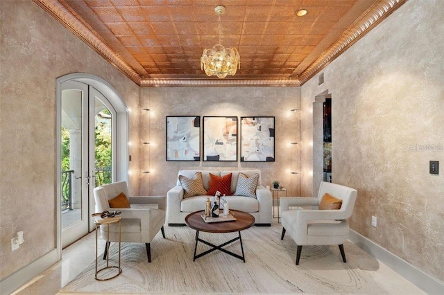 living area featuring a chandelier and french doors