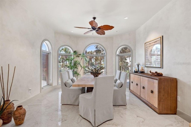 dining space featuring ceiling fan and plenty of natural light