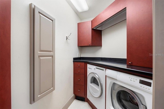 laundry area featuring cabinets and separate washer and dryer