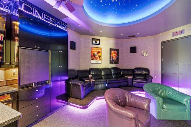 home theater featuring carpet flooring and ceiling fan