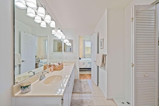 bathroom featuring tile patterned floors and vanity