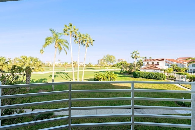 view of yard with a balcony