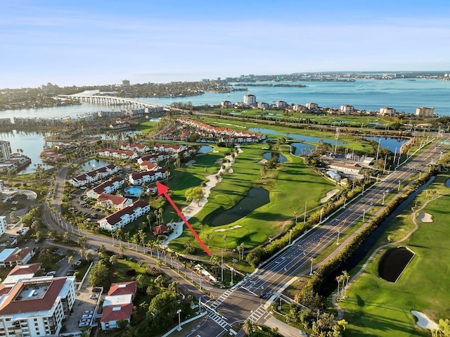 bird's eye view featuring a water view and view of golf course