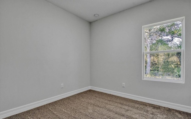 empty room with carpet flooring