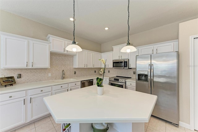 kitchen with white cabinetry, sink, and appliances with stainless steel finishes