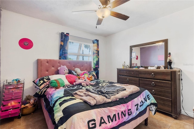 bedroom featuring ceiling fan and light tile patterned flooring