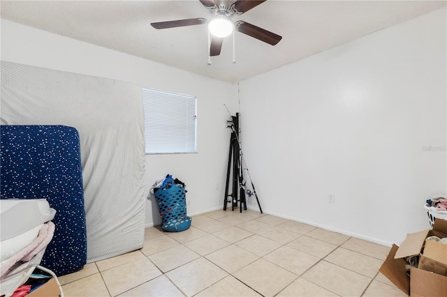 interior space featuring ceiling fan and light tile patterned floors