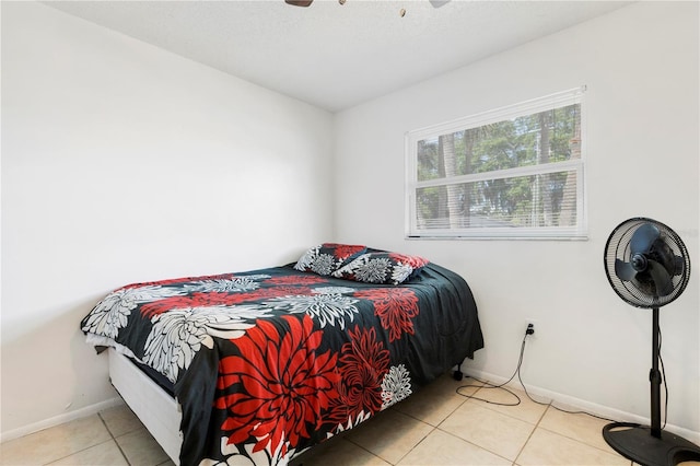 bedroom featuring ceiling fan and light tile patterned floors