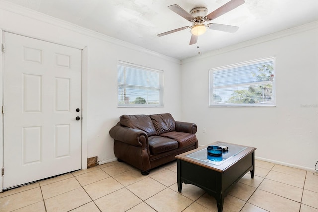 living room with light tile patterned floors, ornamental molding, and a wealth of natural light