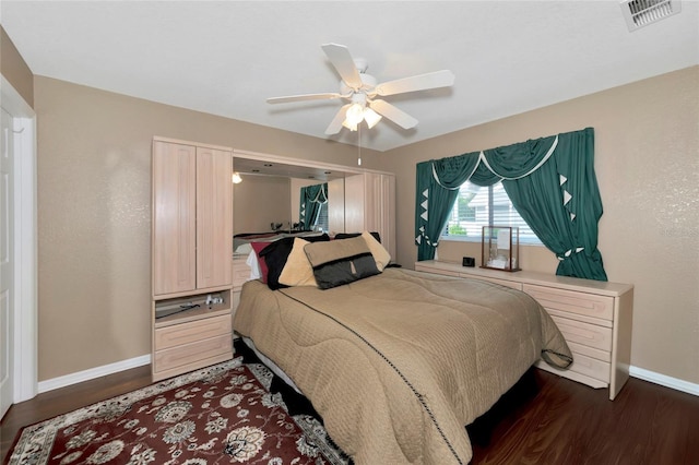 bedroom with dark wood-type flooring and ceiling fan