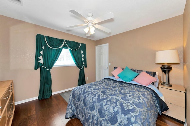 bedroom featuring dark hardwood / wood-style flooring and ceiling fan