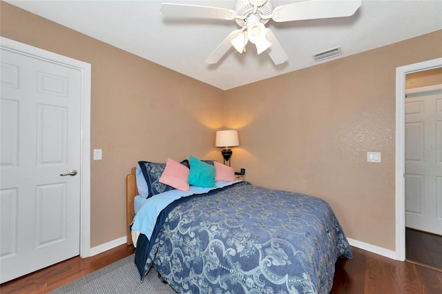 bedroom featuring hardwood / wood-style floors and ceiling fan