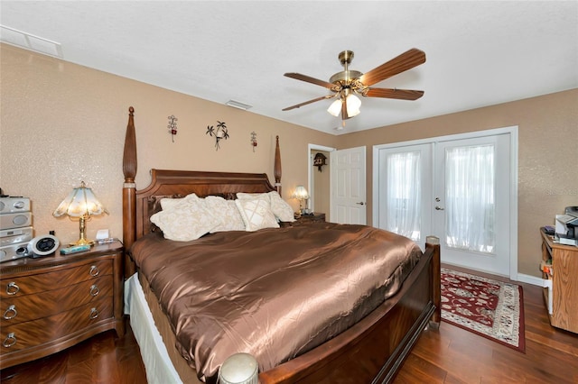 bedroom with dark wood-type flooring, ceiling fan, and french doors