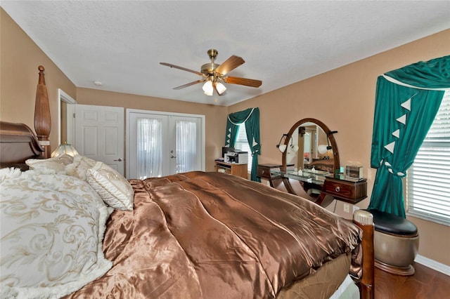 bedroom featuring a textured ceiling, french doors, and ceiling fan