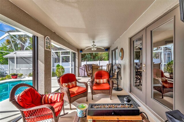 sunroom with french doors and ceiling fan