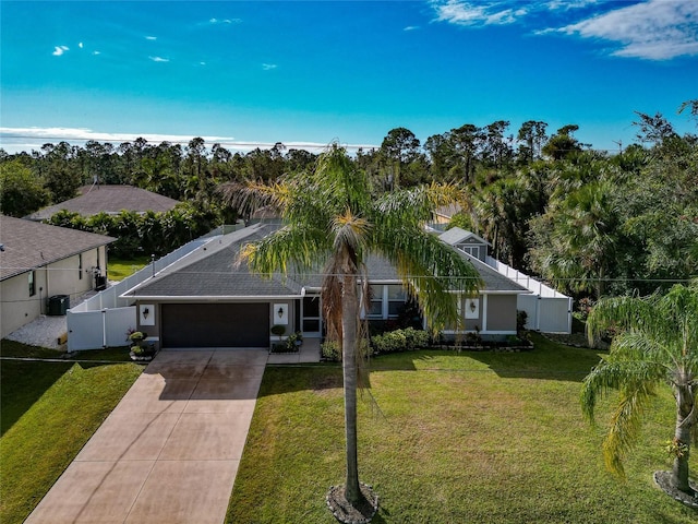 view of front of home featuring a garage and a front lawn