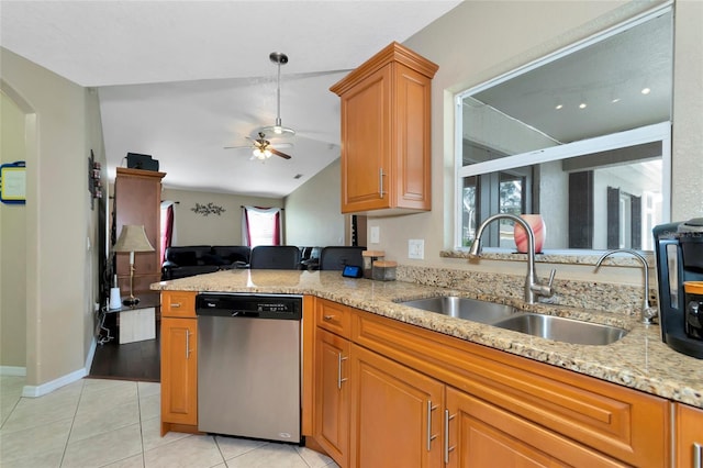 kitchen featuring lofted ceiling, sink, light tile patterned floors, dishwasher, and ceiling fan