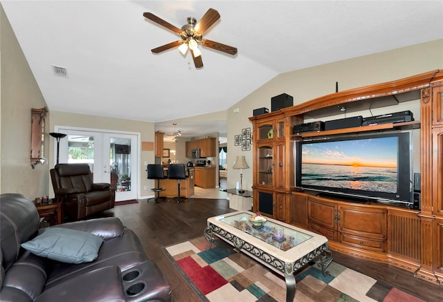 living room featuring dark wood-type flooring, french doors, ceiling fan, and vaulted ceiling