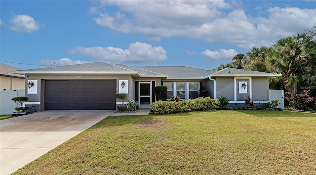 ranch-style house with fence, a garage, concrete driveway, a front lawn, and stucco siding