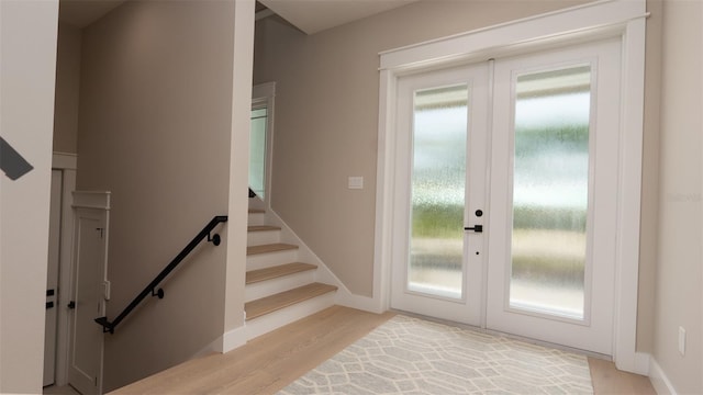 doorway to outside featuring french doors and light wood-type flooring