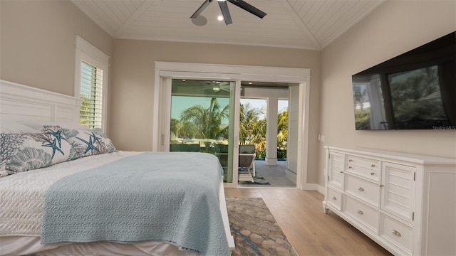 bedroom featuring access to outside, ceiling fan, wooden ceiling, and vaulted ceiling