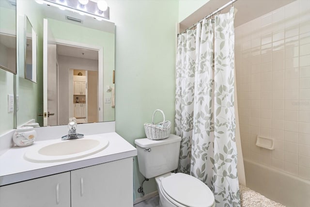 full bathroom featuring shower / tub combo, vanity, and toilet