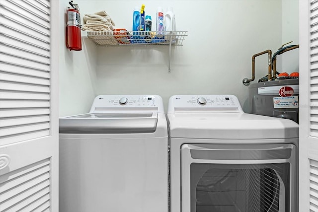 washroom with washer and dryer