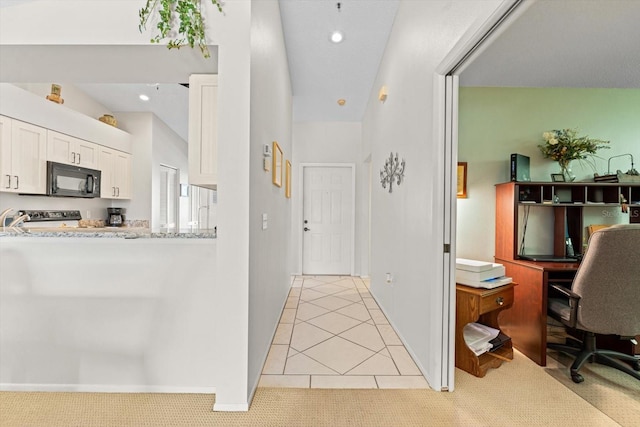 hallway with light tile patterned floors