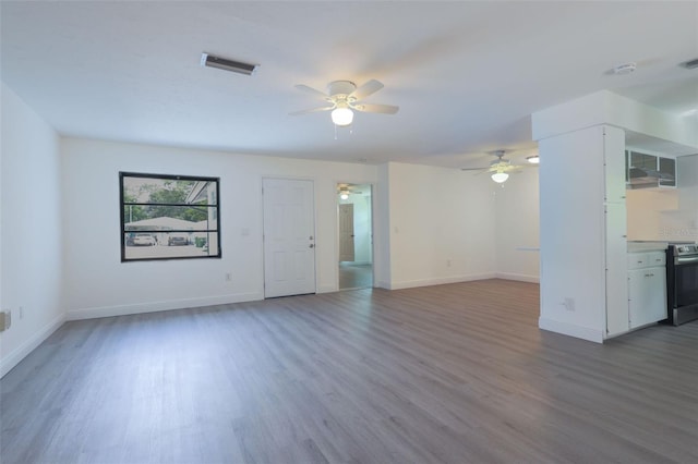 unfurnished living room with hardwood / wood-style floors