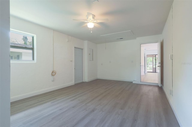 spare room featuring ceiling fan and light hardwood / wood-style flooring