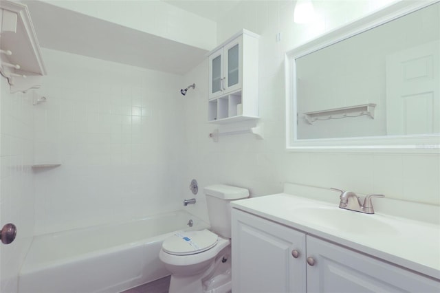 full bathroom featuring vanity, tiled shower / bath combo, toilet, and tile walls