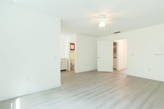 spare room featuring ceiling fan and light hardwood / wood-style flooring