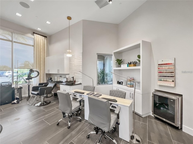 office featuring heating unit and a high ceiling