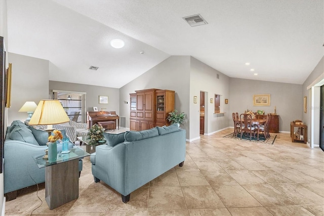 living room featuring lofted ceiling